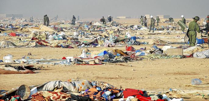 Moroccan security forces break up the tent camp on the outskirts of Western Sahara's capital, Laayoune