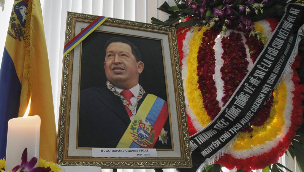 A wreath given by former Vietnamese President Nguyen is placed next to an image of Venezuela's late President Chavez at the Vene