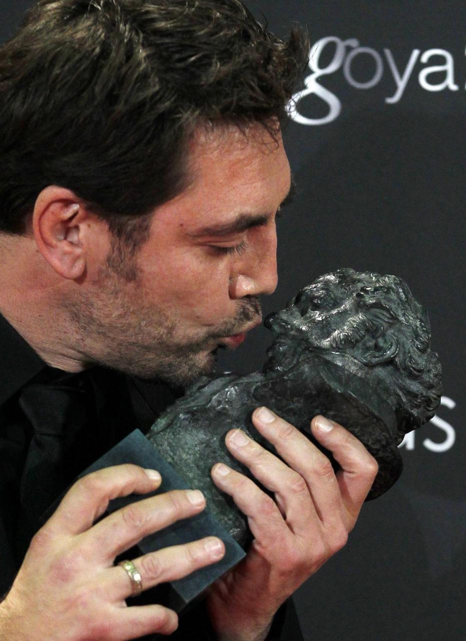 Spanish actor Javier Bardem kisses his award for Best Actor at the Spanish Film Academy's Goya awards ceremony in Madrid