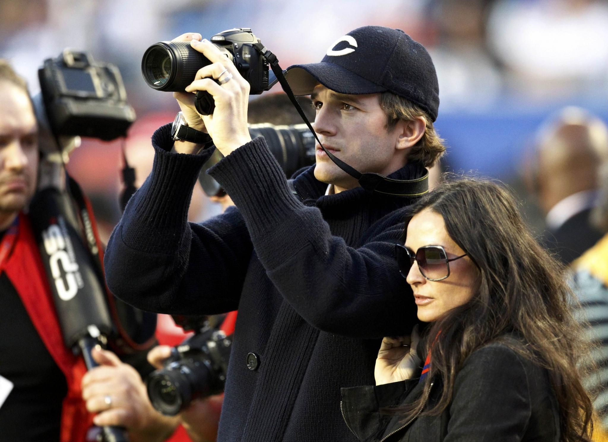 Actors Kutcher and Moore
