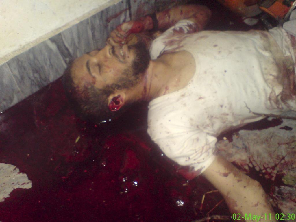The unidentified body of a man is seen after a raid by U.S. Navy SEAL commandos on the compound where al Qaeda leader bin Laden