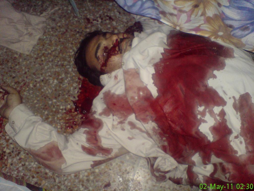 The unidentified body of a man is seen after a raid by U.S. Navy SEAL commandos on the compound where al Qaeda leader bin Laden