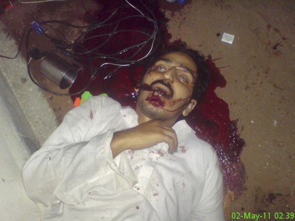 The unidentified body of a man is seen after a raid by U.S. Navy SEAL commandos on the compound where al Qaeda leader bin Laden