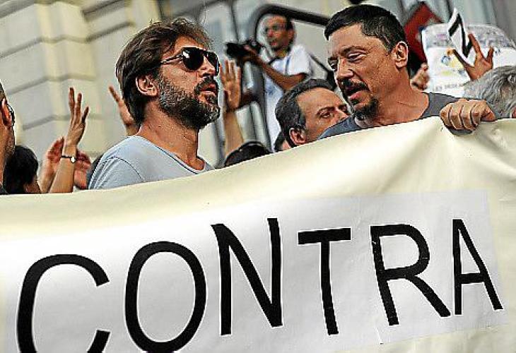 Spanish actor Javier Bardem and his brother Carlos attend a protest against government austerity measures in Madrid