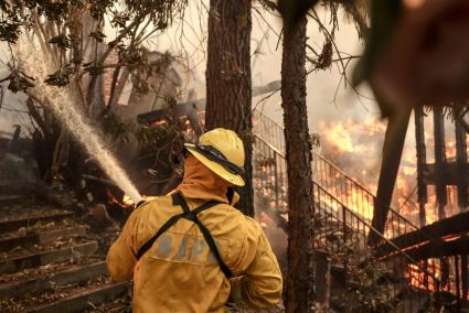 Wildfires force thousands of evacuations in Los Angeles area