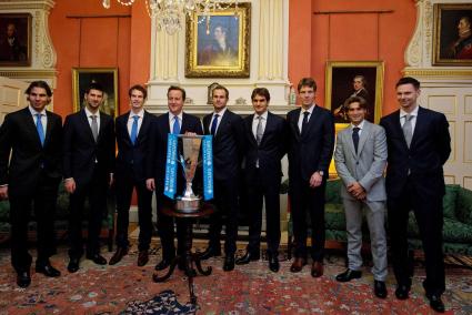 British Prime Minister David Cameron, poses with tennis players in central London