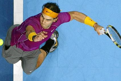 Spain's Nadal serves the ball to Serbia's Djokovic in their singles match at the ATP World Tour Finals in London