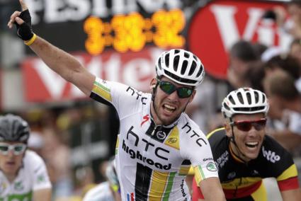 HTC highroad rider Mark Cavendish of Britain celebrates as he crosses the finish line in the fifth stage of the Tour de France 2