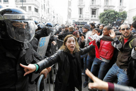 Tunisian protesters clash with riot police during demonstration after death of Tunisian opposition leader Belaid, outside the In